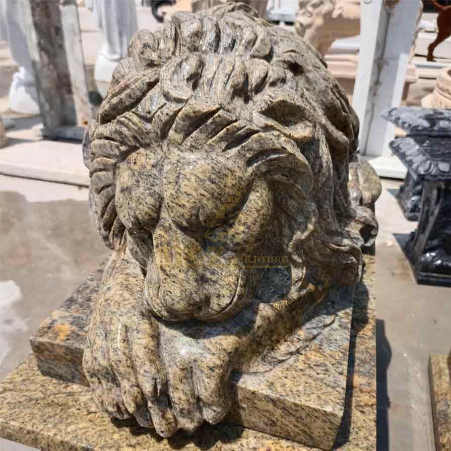 Outdoor marble reclining lion statue of a female