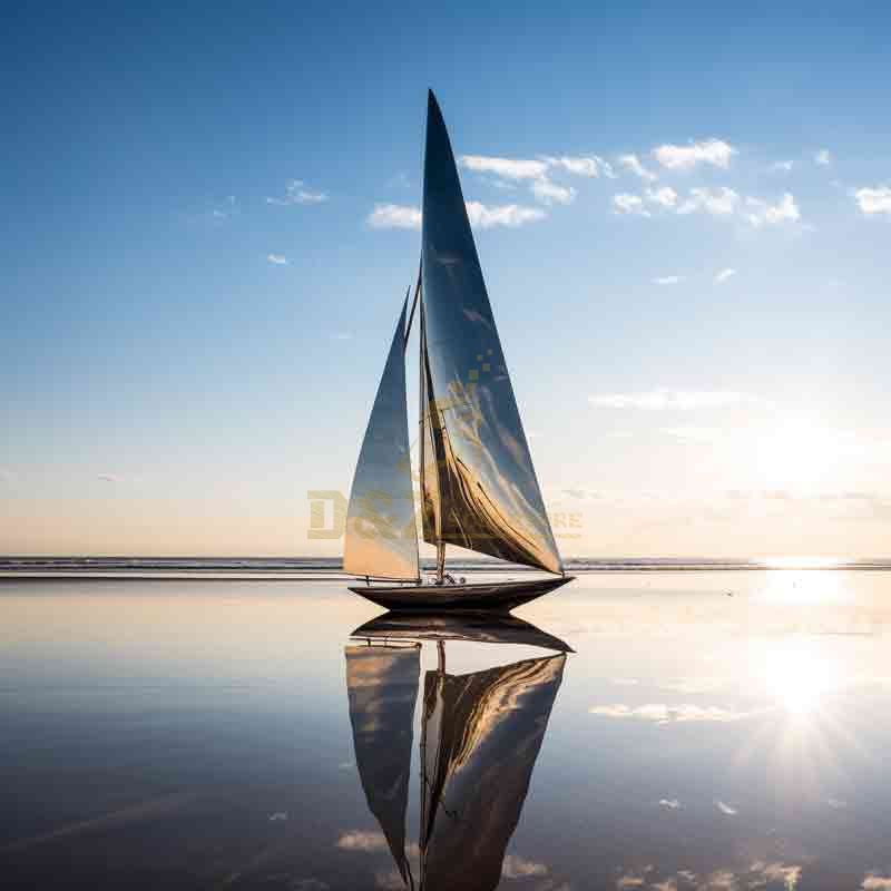 silver sailboat sculpture