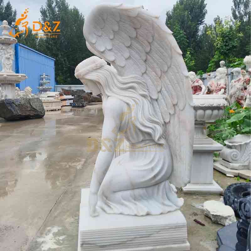 white marble kneeling angel statue