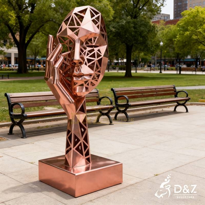 metal face sculpture