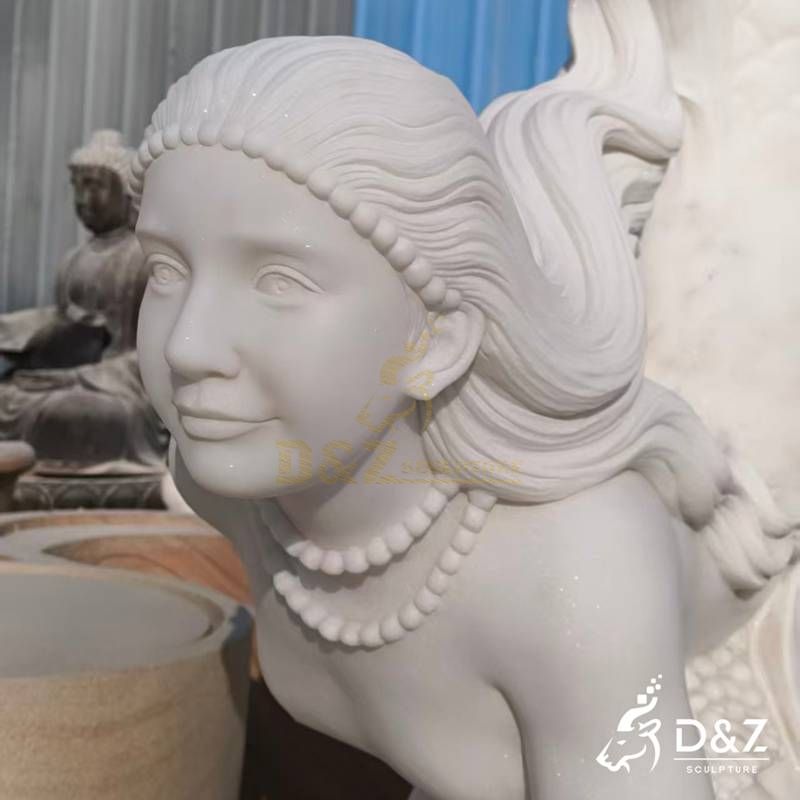 large mermaid statues