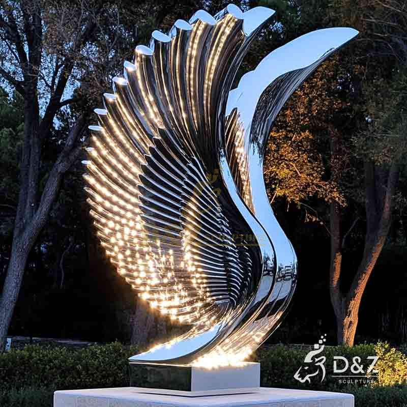 abstract metal wings sculpture with lights