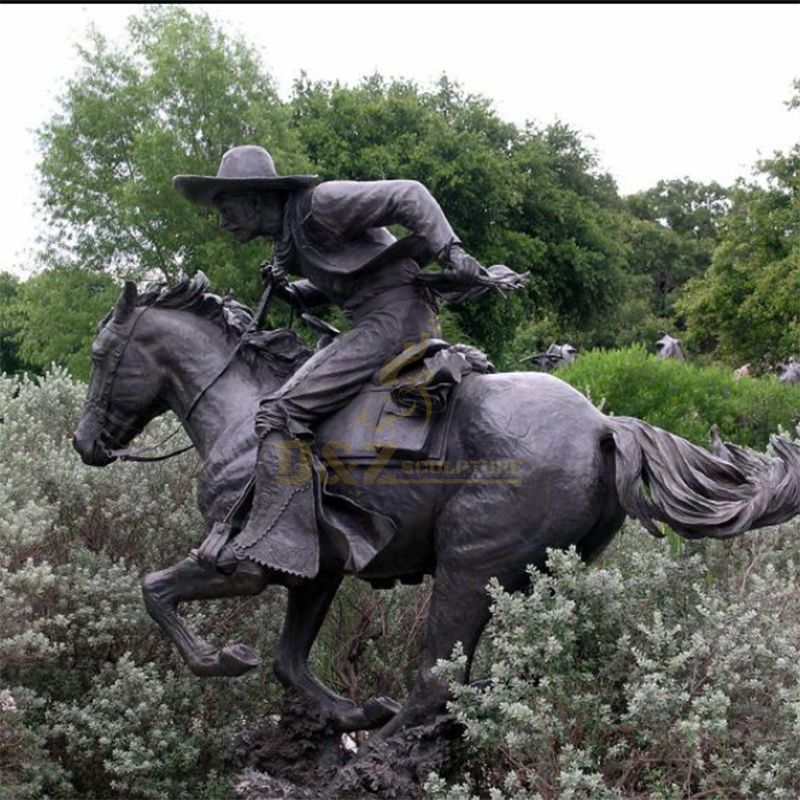 bronze running cowboy statue