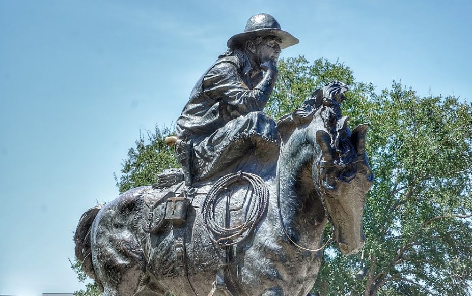 bronze cowboy sculptures with hrose