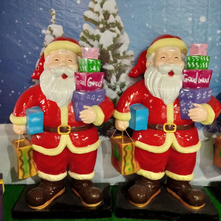 two father Christmas statue