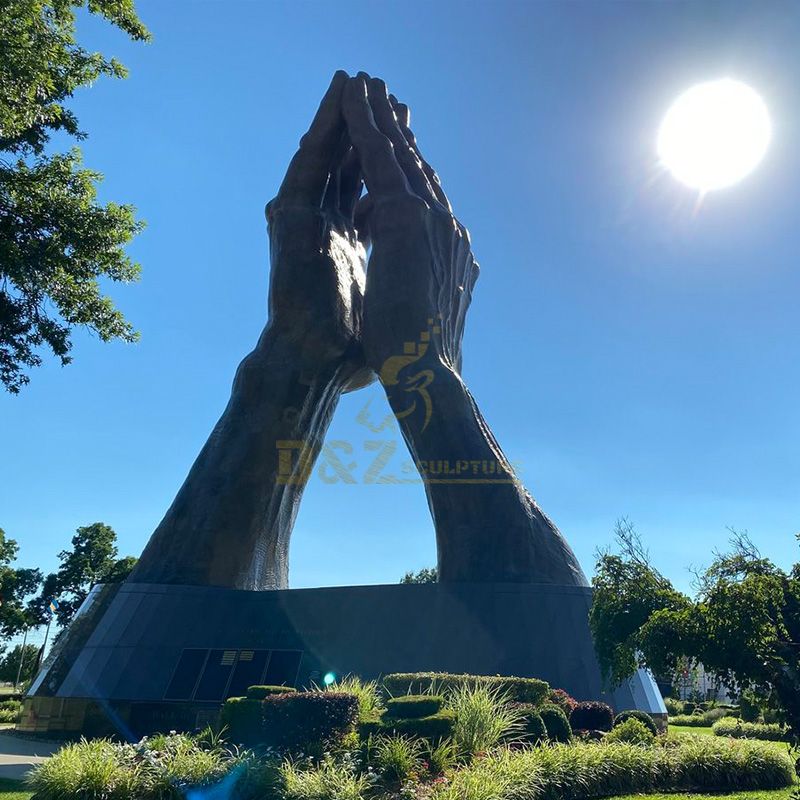 Giant praying hands statue