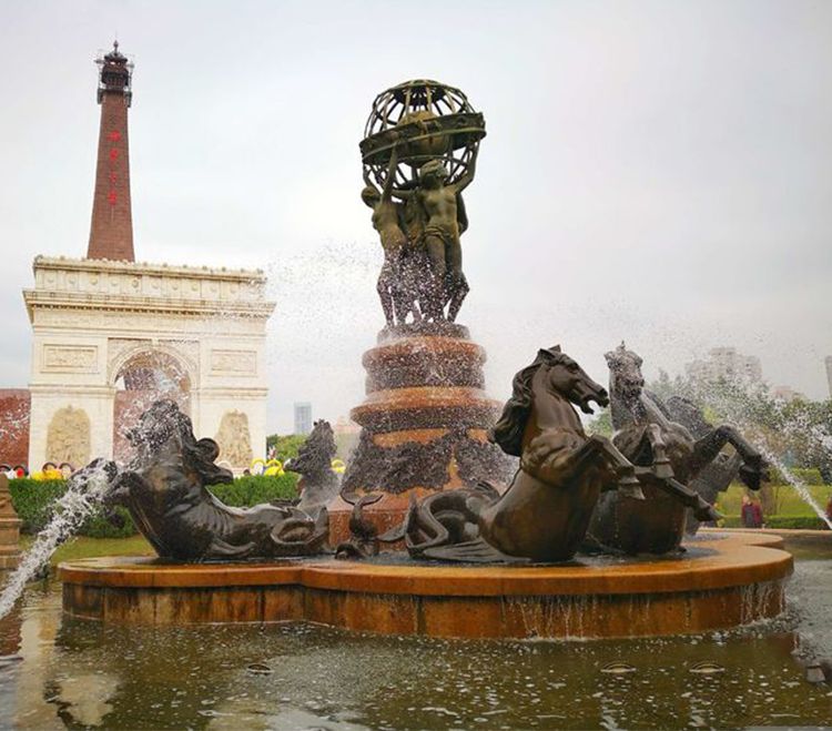 The world is yours statue fountain