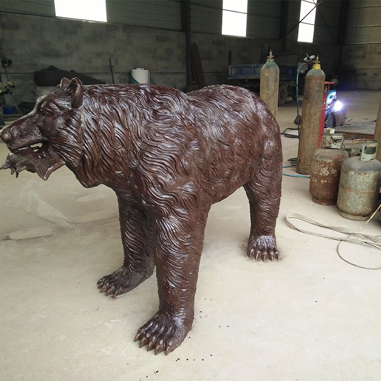 bear catching fish statue