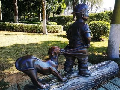 boy and dog garden statue