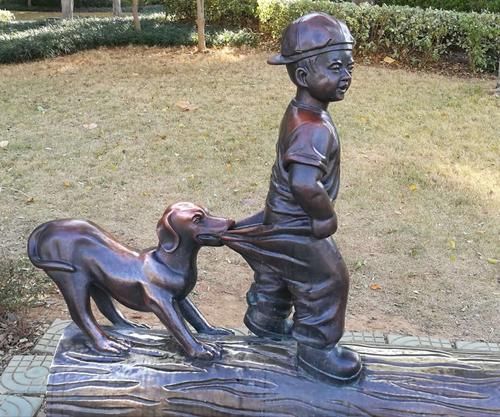 boy with dog garden statue
