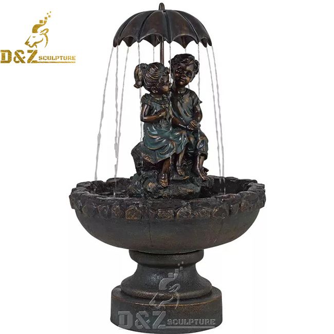boy and girl outdoor water fountain