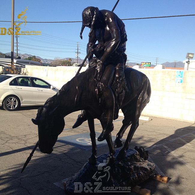 the large bronze end of the trail statue