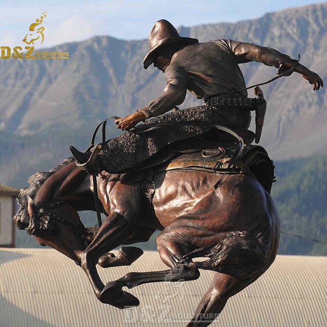 large bronze cowboy on horse statue