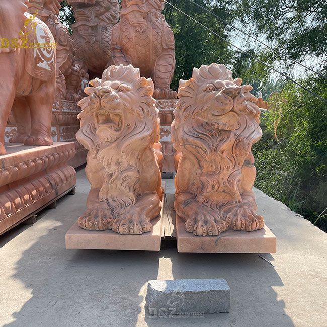 lion statues in front of house