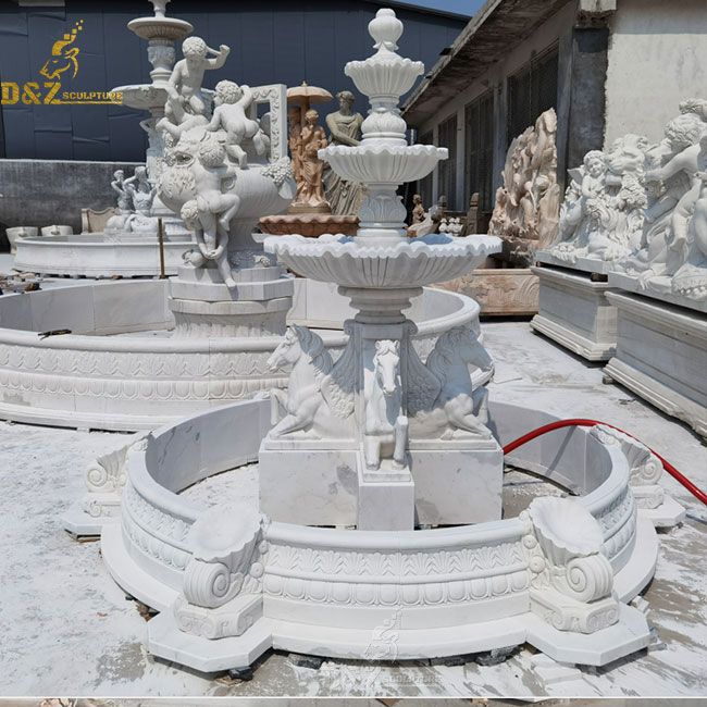 tiered water fountain with horse statue