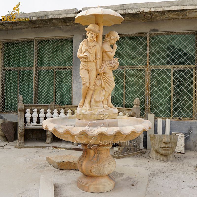 boy and girl umbrella water fountain