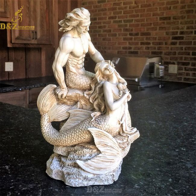 mermaid and merman statue