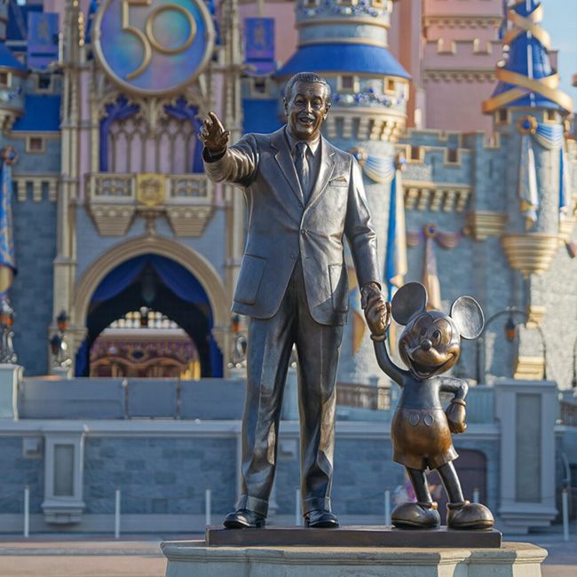 walt disney and mickey mouse statue