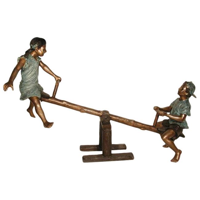 Boy and girl on seesaw garden statue