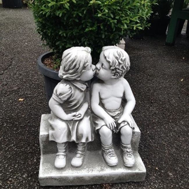 boy and girl garden statues