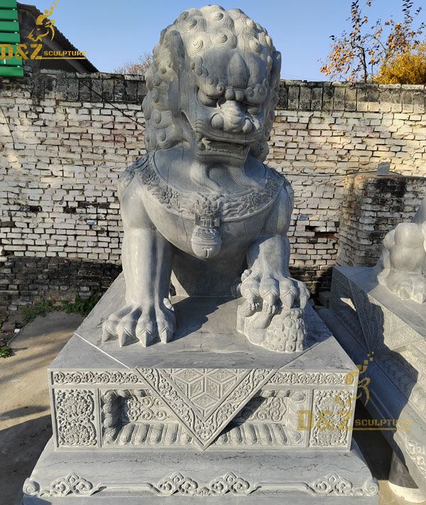 Chinese lion statue with ball