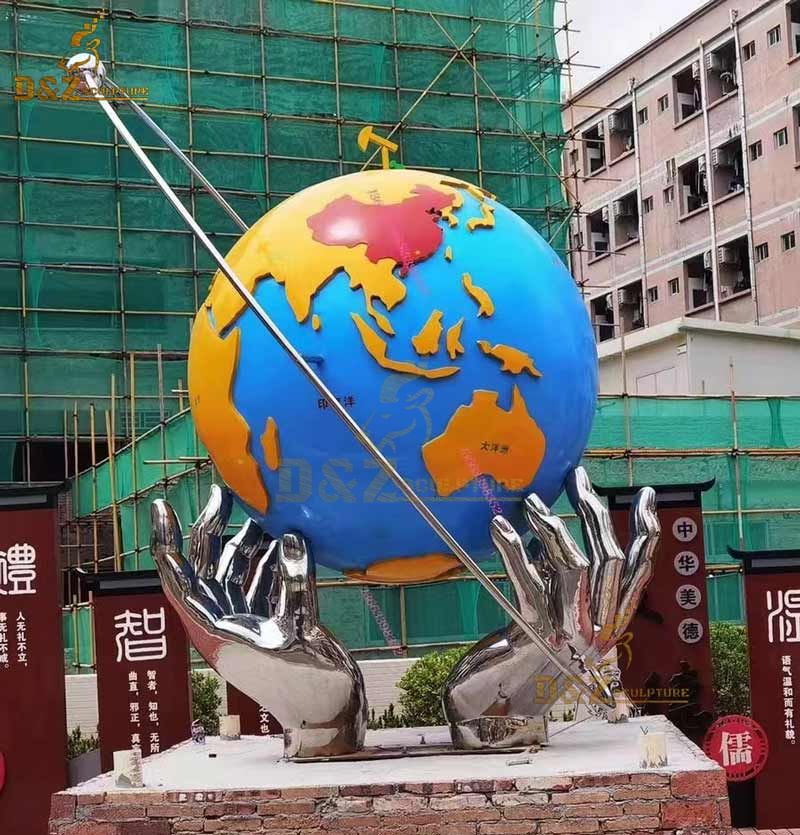 garden globe with hands