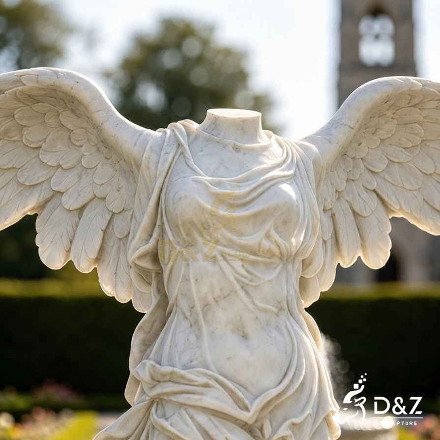 Close‑up detail of carrara marble headless angel wings and torso carving texture Close‑up detail of carrara marble headless angel wings and torso carving texture