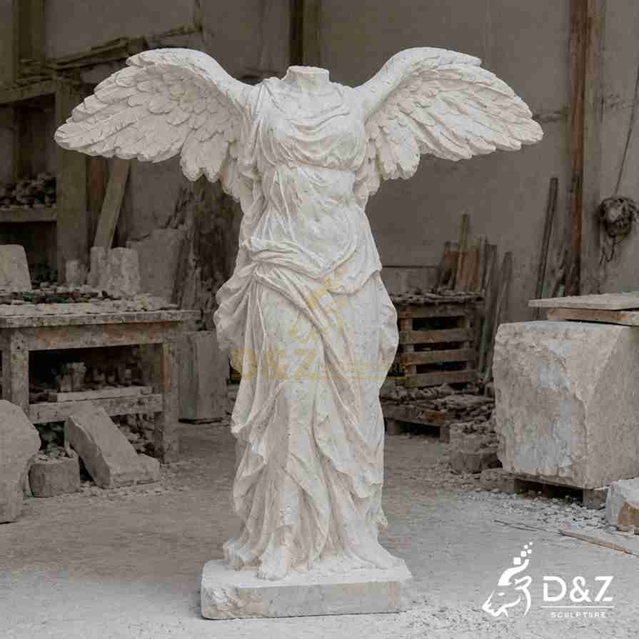 Hand‑carved travertine headless victory angel statue with massive spread wings in stone workshop Hand‑carved travertine headless victory angel statue with massive spread wings in stone workshop