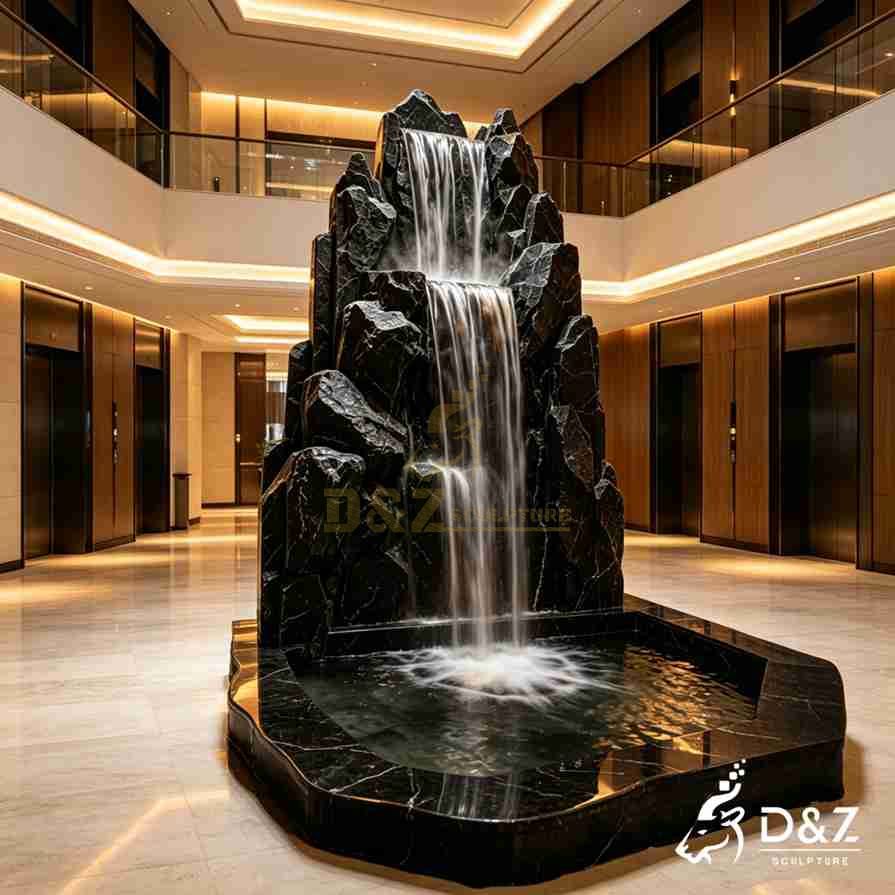 Tall indoor rock fountain with two wide waterfalls and a rounded rectangular marble basin Tall indoor rock fountain with two wide waterfalls and a rounded rectangular marble basin