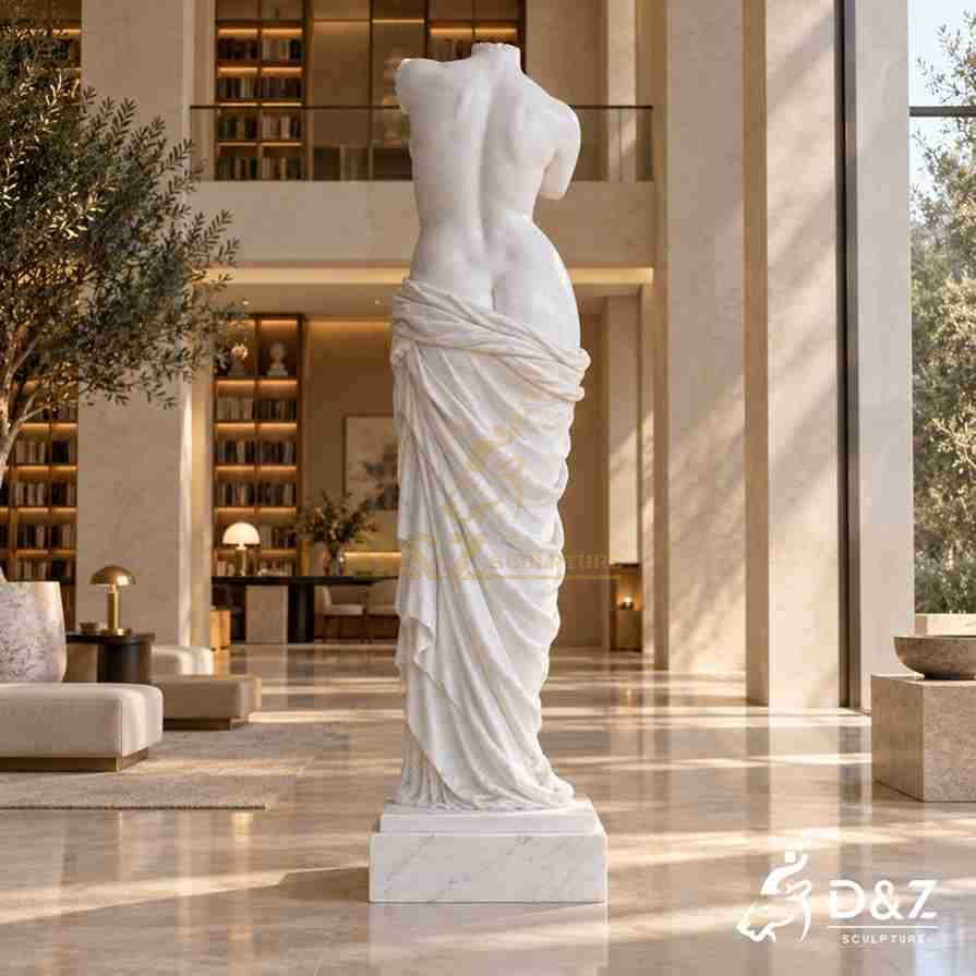 Rear view of a marble Venus body statue with carved back and flowing drapery