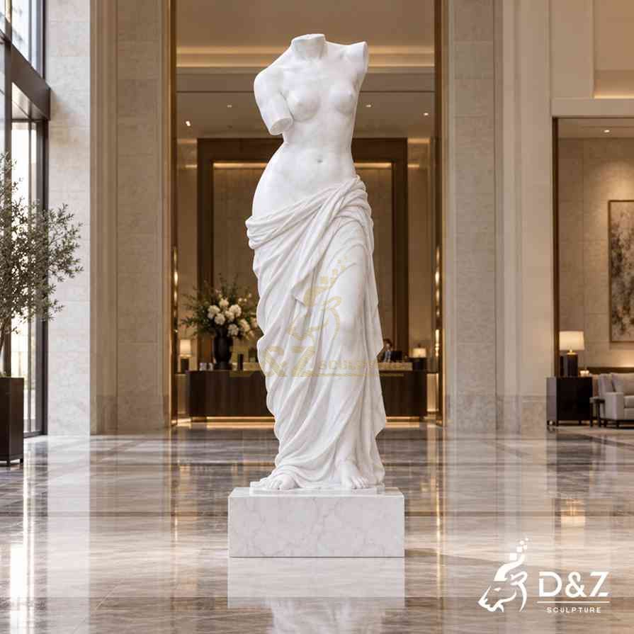 White marble headless Venus statue as a centerpiece in a luxury hotel lobby