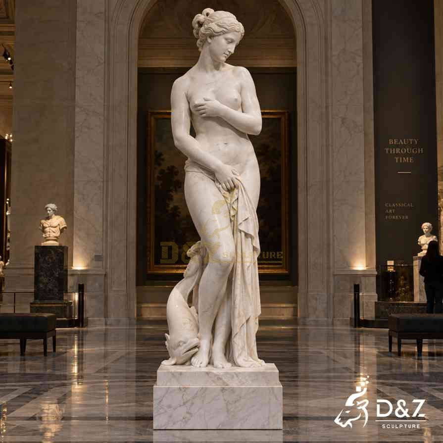 Large marble Venus statue with graceful contrapposto pose, flowing drapery and dolphin support displayed in a museum gallery