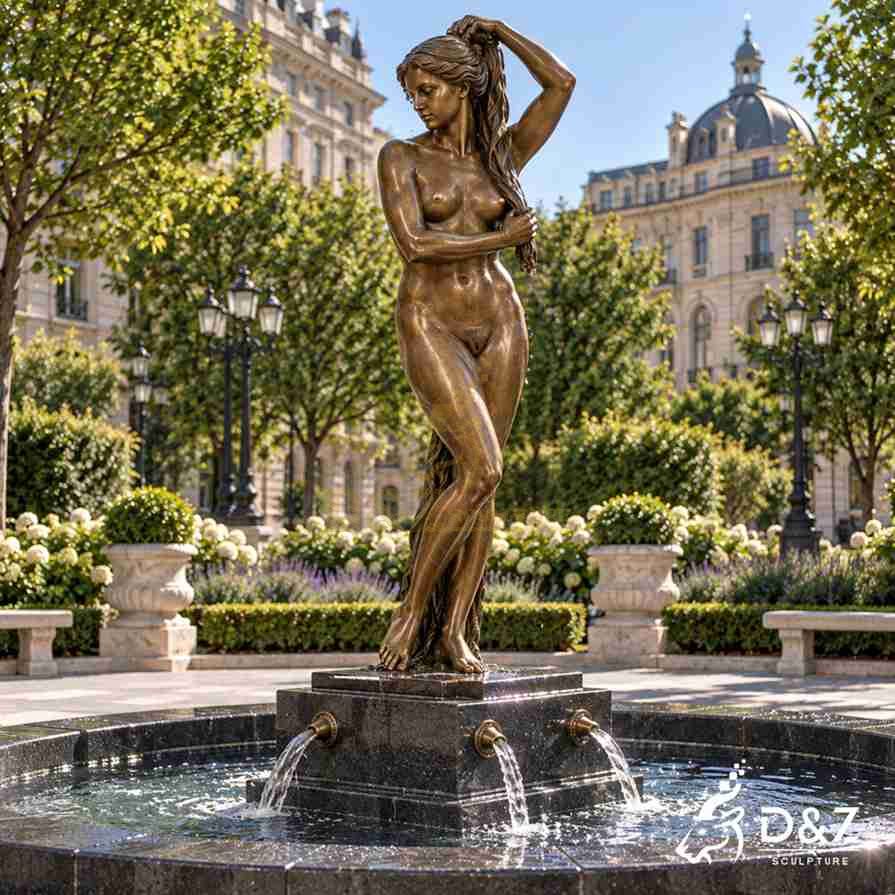 Bronze Venus statue with square fountain base and water spouts in an urban garden plaza Bronze Venus statue with square fountain base and water spouts in an urban garden plaza