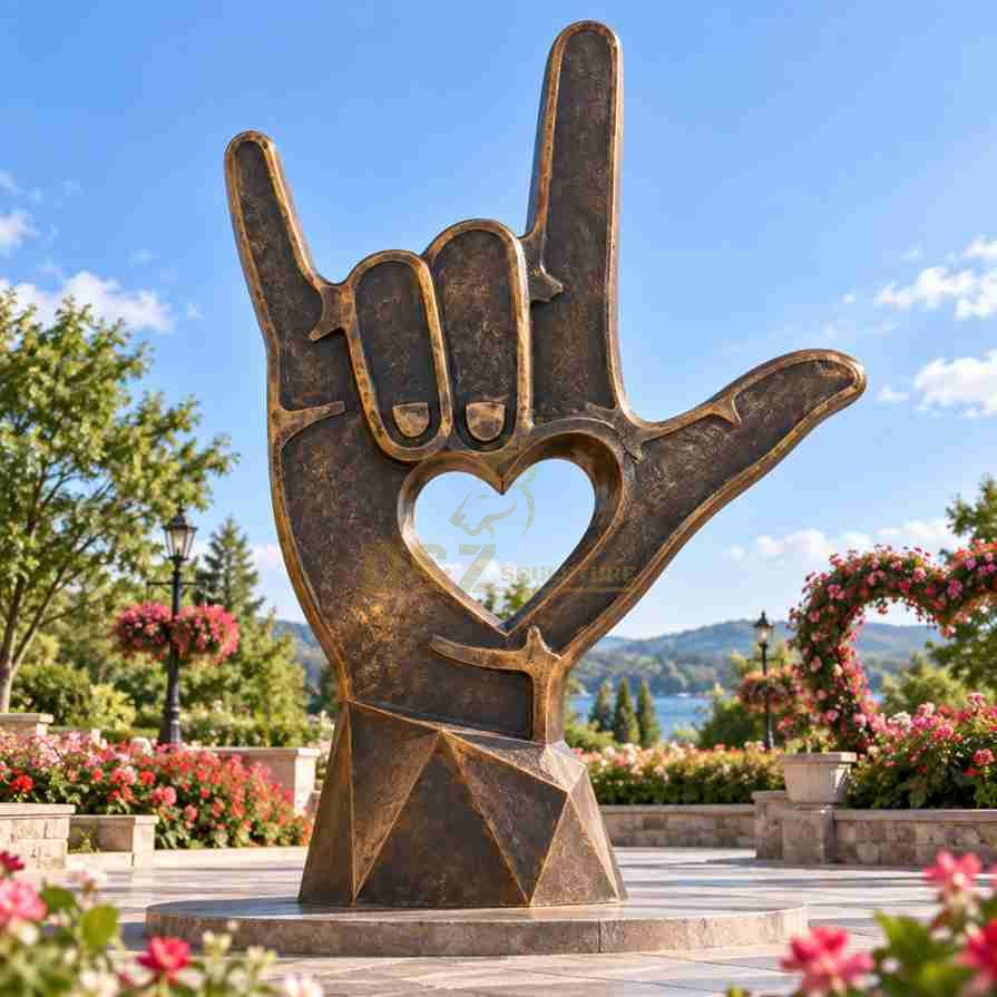 I Love You hand sign sculpture with heart-shaped cutout and antique bronze finish in a love-themed garden I Love You hand sign sculpture with heart-shaped cutout and antique bronze finish in a love-themed garden