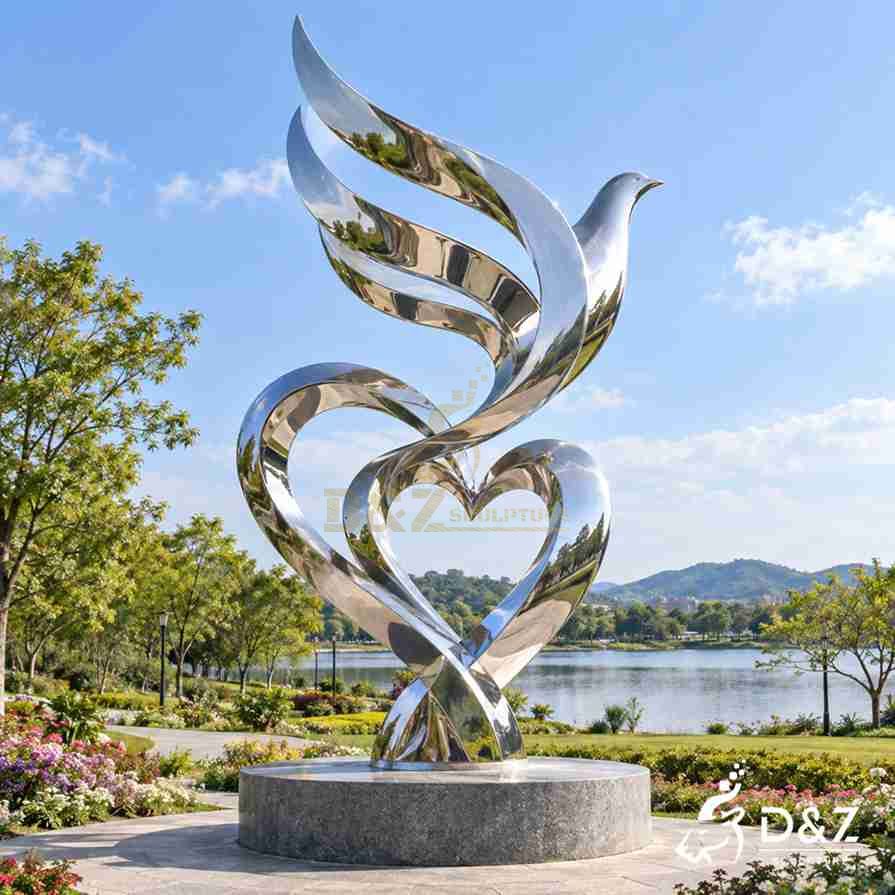 Abstract peace dove sculpture with flowing mirror stainless steel wings and heart-shaped curves in a public park Abstract peace dove sculpture with flowing mirror stainless steel wings and heart-shaped curves in a public park