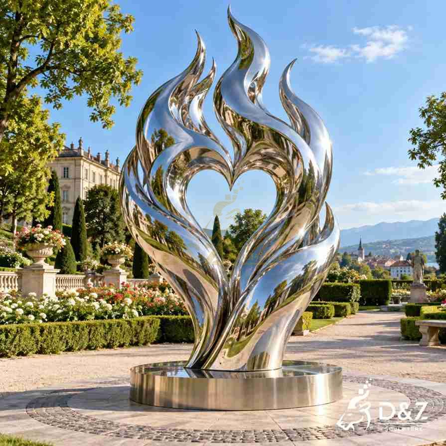 Large flames of love sculpture in mirror stainless steel displayed in a European garden