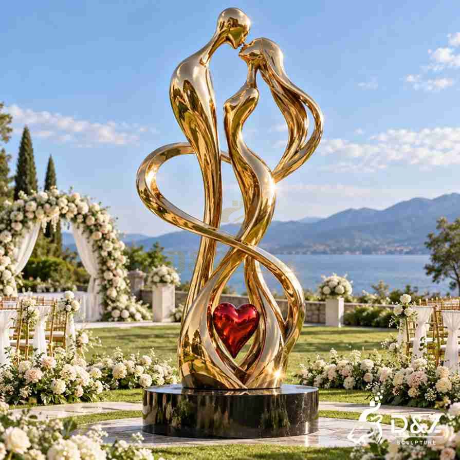 Golden eternal love sculpture displayed at an outdoor wedding venue with lake view