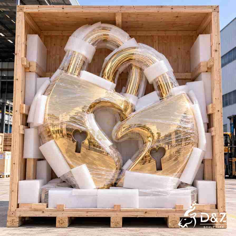 Protective wooden crate packing for a large golden love lock sculpture with foam cushioning Protective wooden crate packing for a large golden love lock sculpture with foam cushioning