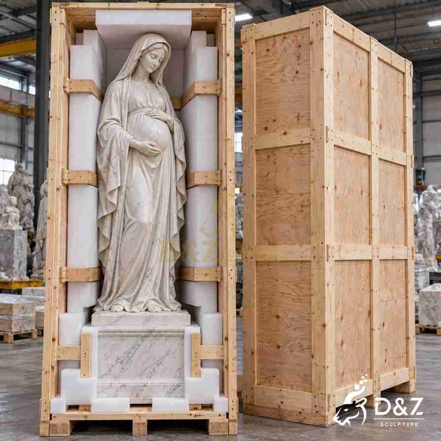 White marble pregnant Virgin Mary statue protected with foam supports inside a reinforced wooden shipping crate, shown alongside the closed export crate. White marble pregnant Virgin Mary statue protected with foam supports inside a reinforced wooden shipping crate, shown alongside the closed export crate.
