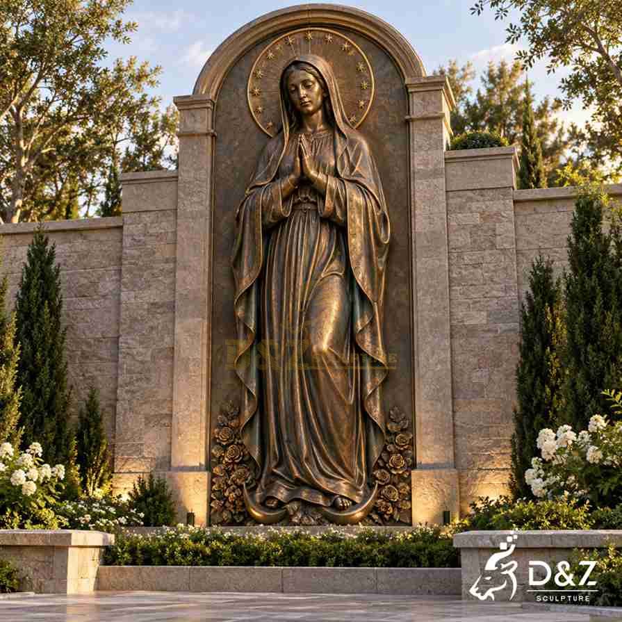 Bronze Virgin Mary wall statue with hands joined in prayer, a decorative star halo, long flowing robes, and an antique bronze surface finish. Bronze Virgin Mary wall statue with hands joined in prayer, a decorative star halo, long flowing robes, and an antique bronze surface finish.