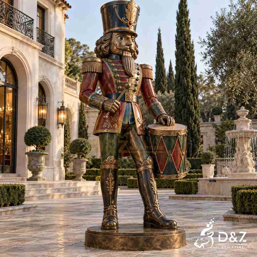 Traditional bronze Christmas nutcracker drummer statue with a decorated military uniform and ceremonial drum in a classical villa courtyard. Traditional bronze Christmas nutcracker drummer statue with a decorated military uniform and ceremonial drum in a classical villa courtyard.