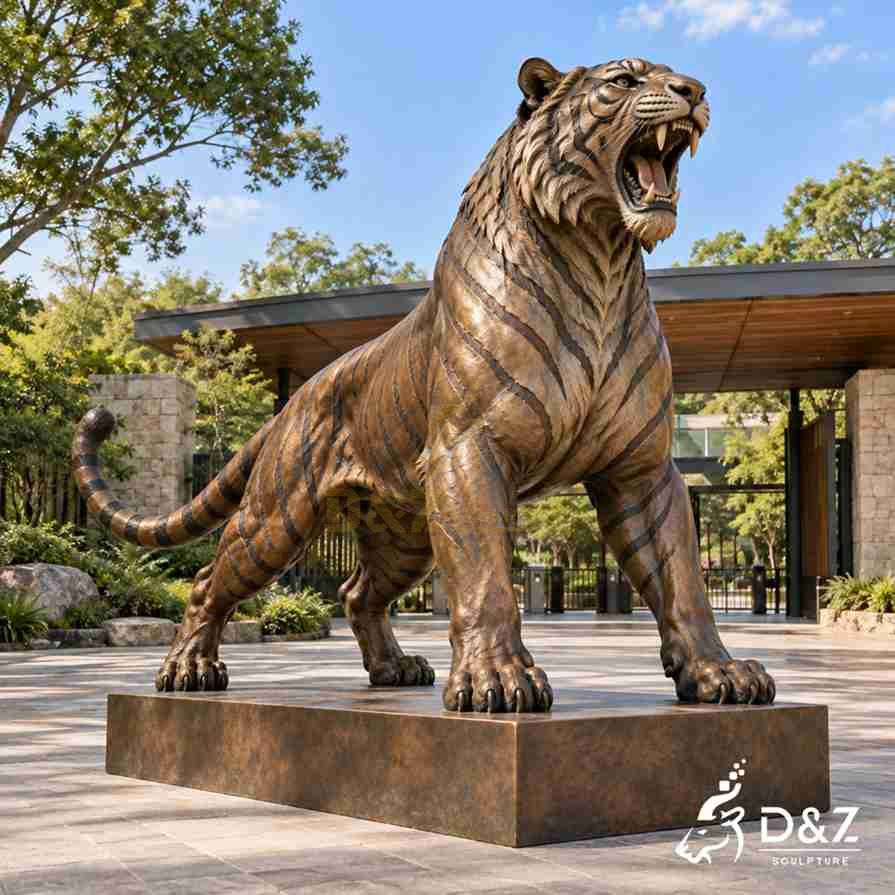 Large outdoor bronze tiger statue roaring with an open mouth, sharp fangs, and realistic dark stripes. Large outdoor bronze tiger statue roaring with an open mouth, sharp fangs, and realistic dark stripes.