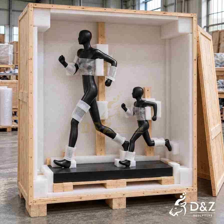 Running father and son sculpture secured inside a wooden shipping crate with foam padding and protective wrapping. Running father and son sculpture secured inside a wooden shipping crate with foam padding and protective wrapping.