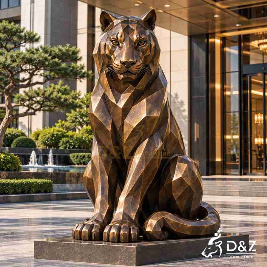 Geometric bronze sitting tiger statue with faceted surfaces, upright front legs and a curled tail on a rectangular base. Geometric bronze sitting tiger statue with faceted surfaces, upright front legs and a curled tail on a rectangular base.